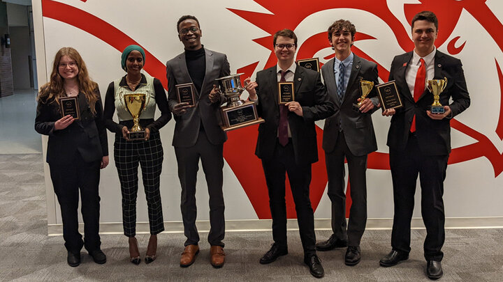 Nicholas Wallenburg and Zachary Wallenberg with members of the national champion debate team