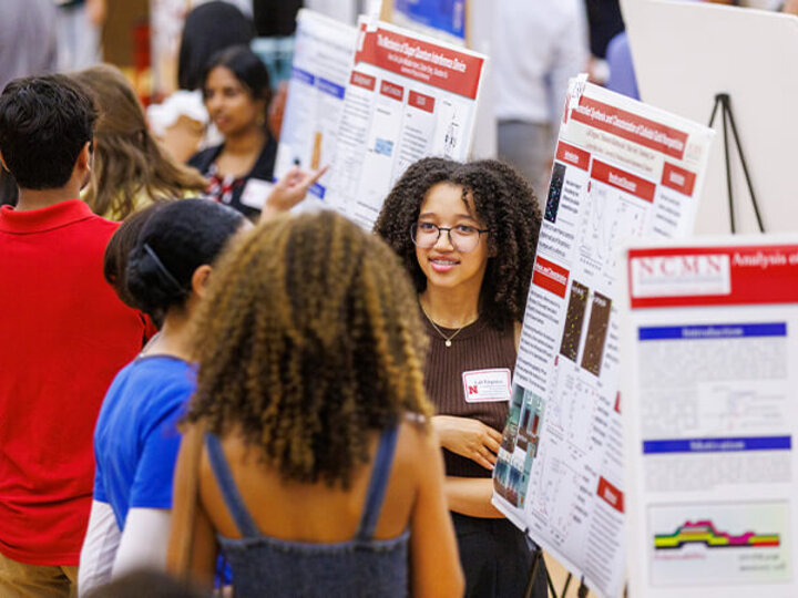 Students talking at booths