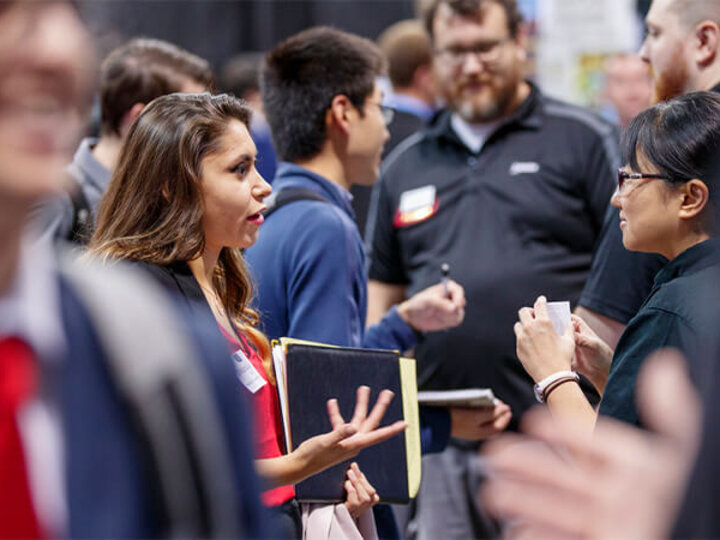 People talking at booths